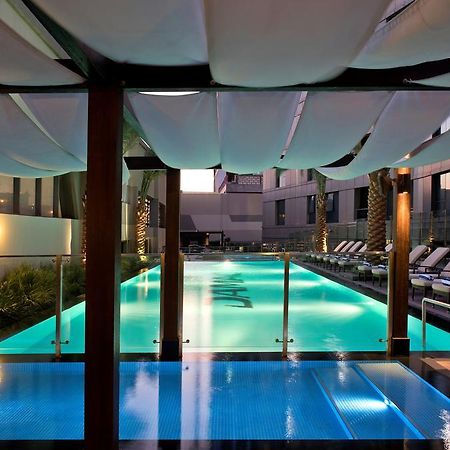 Damac Maison The Vogue ดูไบ ภายนอก รูปภาพ The pool at the hotel