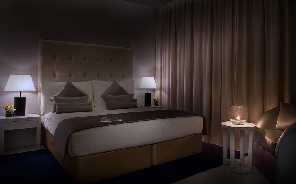 Damac Maison The Vogue ดูไบ ภายนอก รูปภาพ A bedroom at the hotel