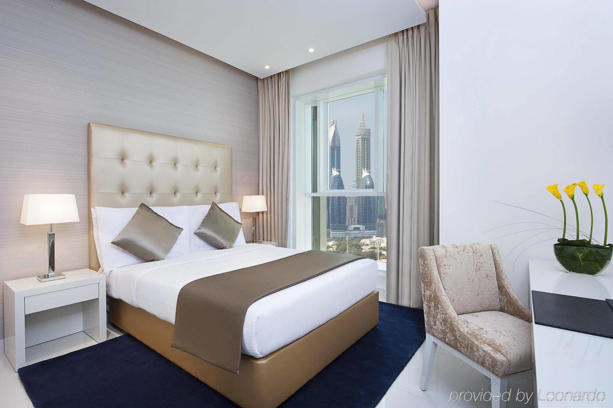 Damac Maison The Vogue ดูไบ ภายนอก รูปภาพ A bedroom at the hotel