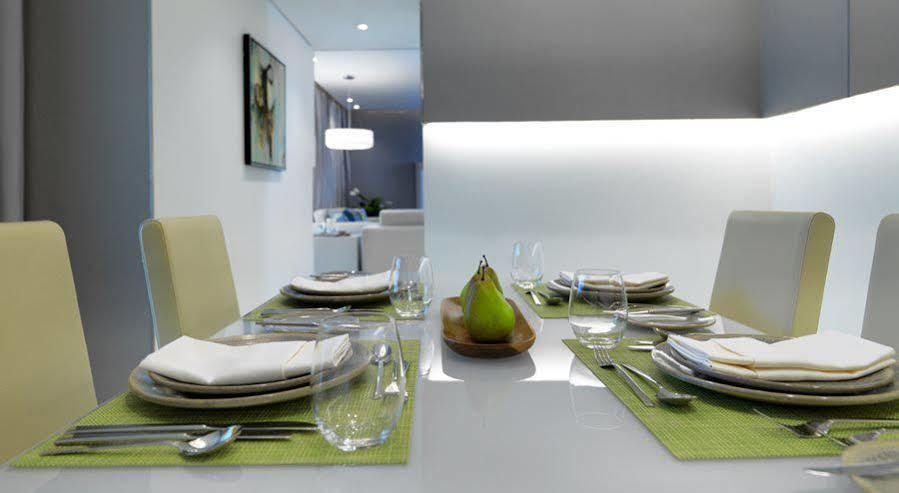 Damac Maison The Vogue ดูไบ ภายนอก รูปภาพ A table set for a meal