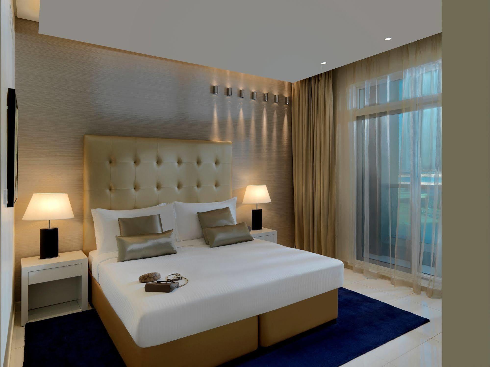 Damac Maison The Vogue ดูไบ ภายนอก รูปภาพ A bedroom at the hotel